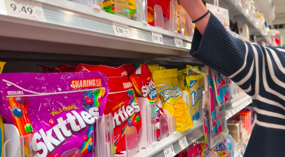 Colorful candy lines the shelves of a local grocery store. 